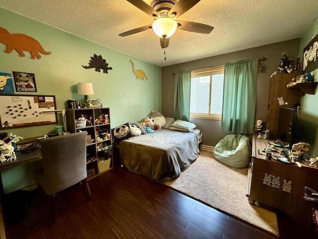 1411 Jennifer Ave, Tomah, WI 54660 - bedroom with ceiling fan, a textured ceiling, and wood finished floors
