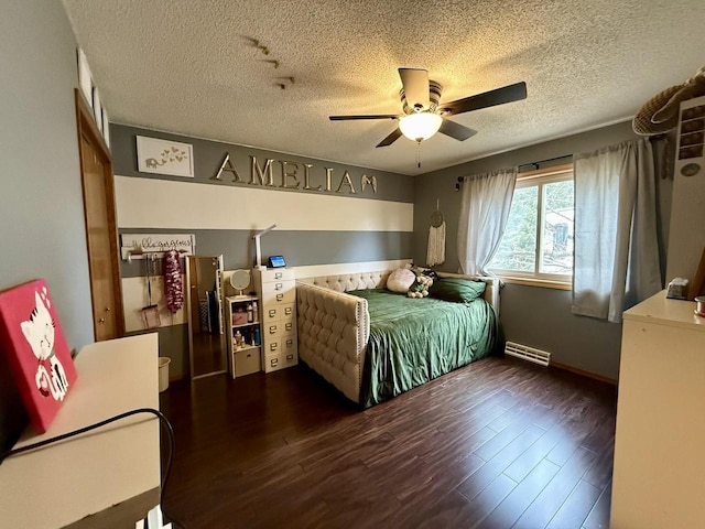 1411 Jennifer Ave, Tomah, WI 54660 - bedroom featuring visible vents, baseboards, ceiling fan, a textured ceiling, and wood finished floors