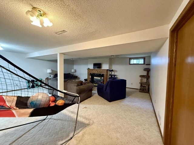 1411 Jennifer Ave, Tomah, WI 54660 - living area featuring light carpet, a glass covered fireplace, and a textured ceiling