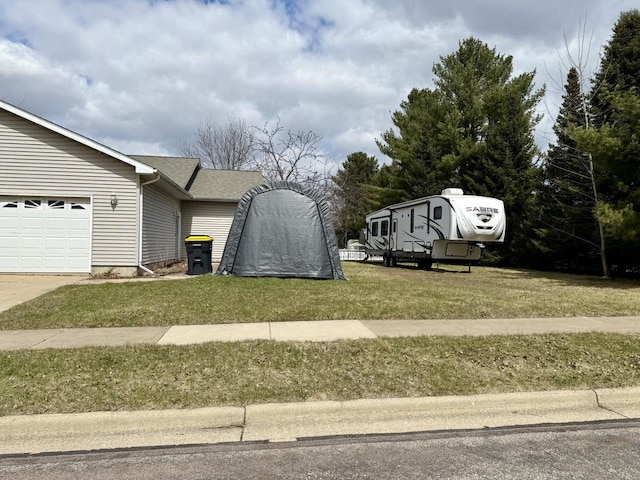 1411 Jennifer Ave, Tomah, WI 54660 - view of side of property with roof with shingles and a lawn