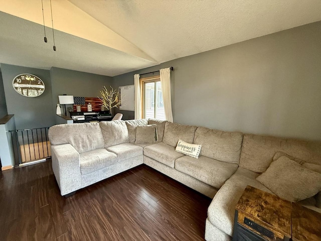 1411 Jennifer Ave, Tomah, WI 54660 - living room featuring vaulted ceiling and wood finished floors