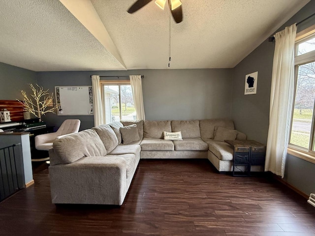 1411 Jennifer Ave, Tomah, WI 54660 - living area with dark wood-style flooring, ceiling fan, plenty of natural light, and a textured ceiling