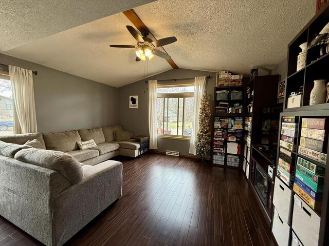 1411 Jennifer Ave, Tomah, WI 54660 - living room featuring a textured ceiling, wood finished floors, a ceiling fan, and lofted ceiling