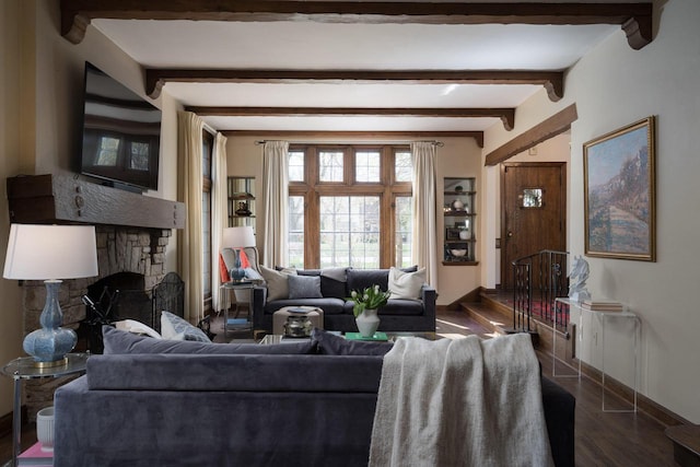 living area with beamed ceiling, dark wood-style flooring, baseboards, and a fireplace