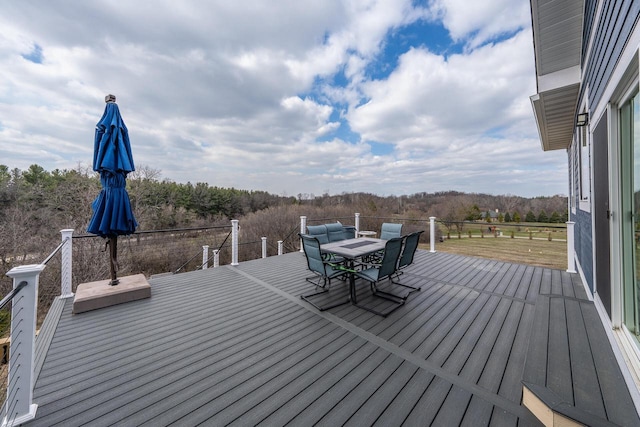 deck with outdoor dining area