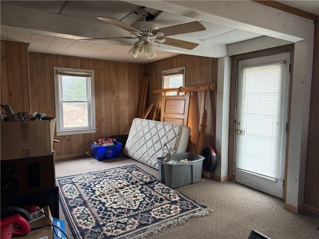 3168 W Howard St, Winter, WI 54896 - bedroom featuring wood walls, baseboards, and a ceiling fan