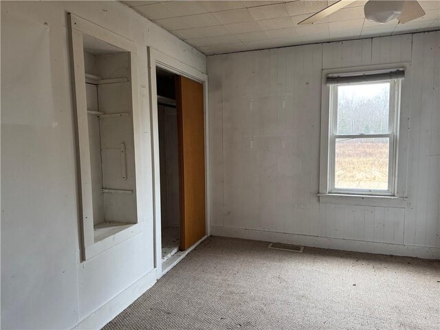 3168 W Howard St, Winter, WI 54896 - unfurnished bedroom with multiple windows, visible vents, and carpet floors