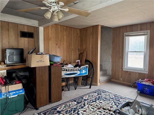 3168 W Howard St, Winter, WI 54896 - misc room with wooden walls, visible vents, and ceiling fan