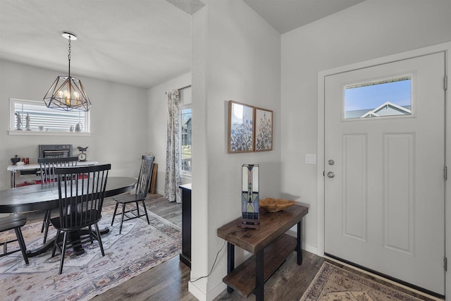 3247 Prospect Dr, Sun Prairie, WI 53590 - foyer featuring baseboards, wood finished floors, and a notable chandelier
