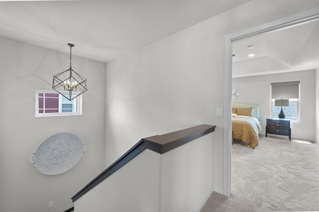 3247 Prospect Dr, Sun Prairie, WI 53590 - corridor with an upstairs landing, carpet flooring, a chandelier, and baseboards