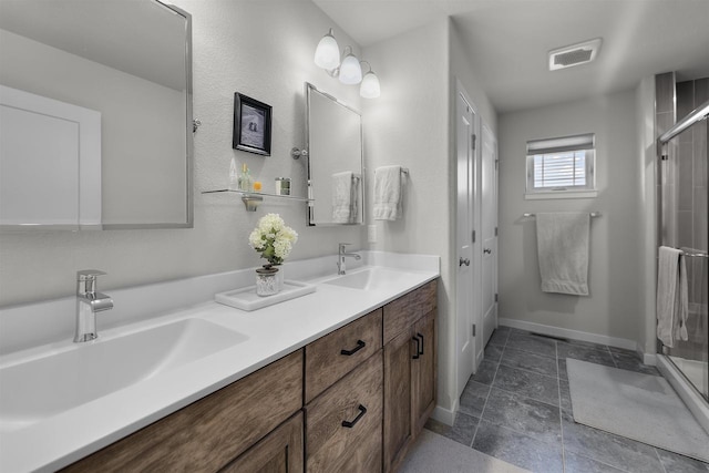 3247 Prospect Dr, Sun Prairie, WI 53590 - full bath featuring double vanity, visible vents, a shower stall, and a sink