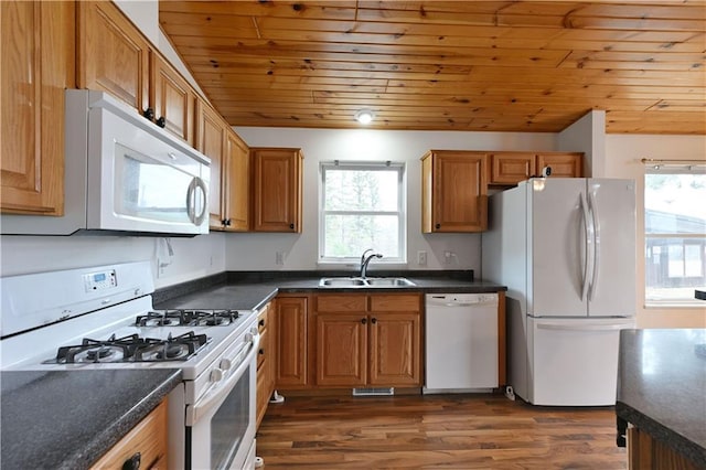 kitchen with a sink, wooden ceiling, white appliances, and plenty of natural light