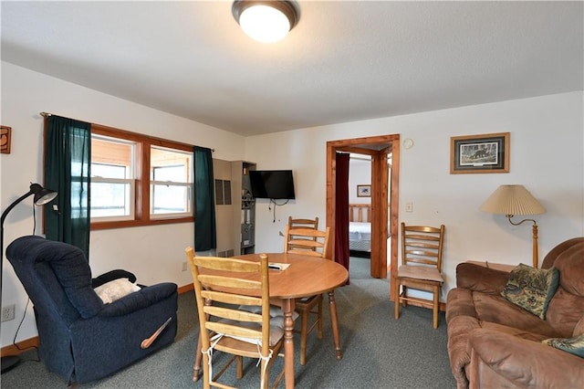 dining area with dark colored carpet