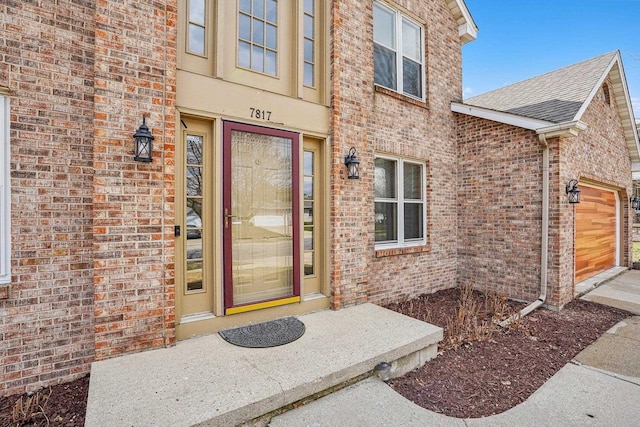 7817 Brule St, Madison, WI 53717 - property entrance with a garage and brick siding