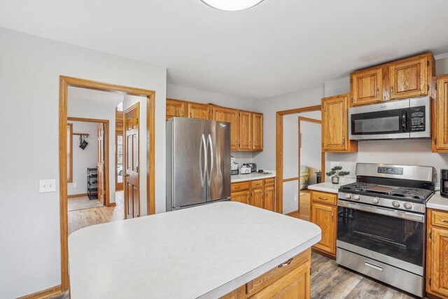 7817 Brule St, Madison, WI 53717 - kitchen with light countertops, light wood-style flooring, and stainless steel appliances