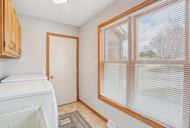 7817 Brule St, Madison, WI 53717 - laundry room featuring cabinet space and independent washer and dryer