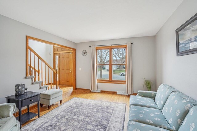 7817 Brule St, Madison, WI 53717 - living area with wood finished floors, baseboards, and stairs