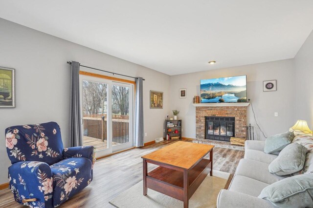 7817 Brule St, Madison, WI 53717 - living room with baseboards, wood finished floors, and a fireplace
