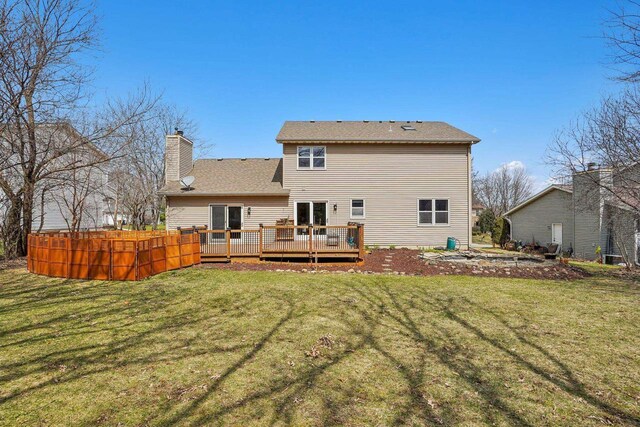 7817 Brule St, Madison, WI 53717 - rear view of property with a yard, a wooden deck, and a chimney