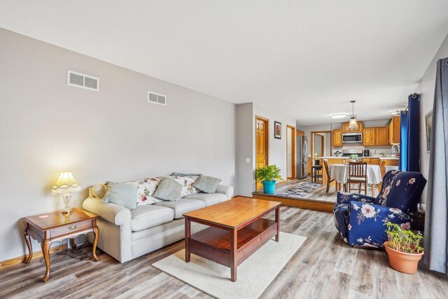 7817 Brule St, Madison, WI 53717 - living room featuring visible vents and light wood finished floors