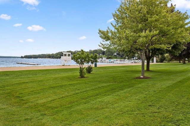 surrounding community featuring a yard and a water view