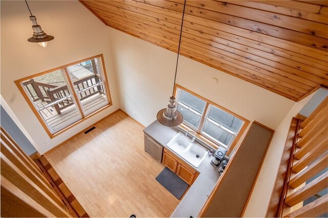 318 Meadow Lark Ln, Osceola, WI 54020 - living room featuring stairs, visible vents, high vaulted ceiling, wooden ceiling, and wood finished floors