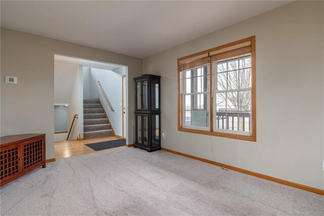 318 Meadow Lark Ln, Osceola, WI 54020 - empty room with baseboards, stairway, and carpet floors