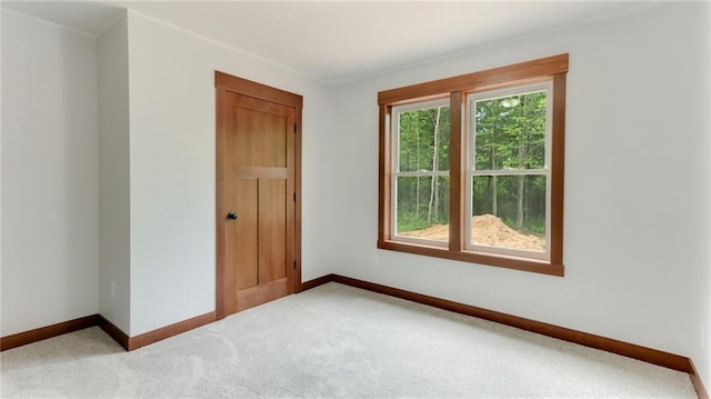 24888 65th Ave, Cadott, WI 54727 - spare room featuring baseboards and carpet