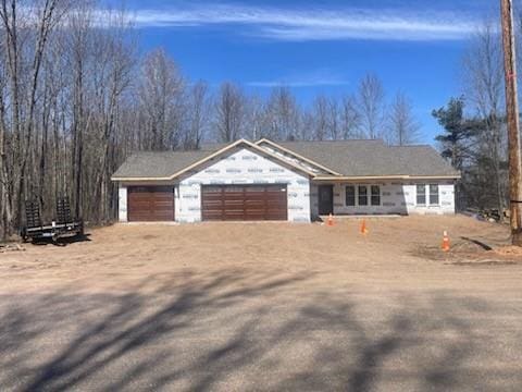view of front of home with an attached garage and driveway
