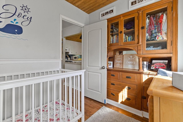 W3780 Cypress Dr, Lake Geneva, WI 53147 - bedroom featuring light wood finished floors and wood ceiling