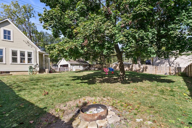 W3780 Cypress Dr, Lake Geneva, WI 53147 - view of yard with a fenced backyard and an outdoor fire pit