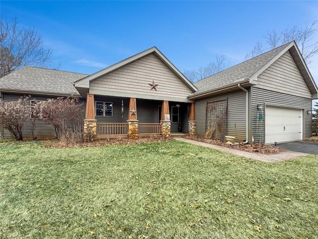10244 124th St, Chippewa Falls, WI 54729 - ranch-style home with a front yard, an attached garage, a shingled roof, and covered porch
