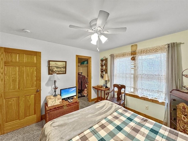 10244 124th St, Chippewa Falls, WI 54729 - carpeted bedroom with a closet, a walk in closet, baseboards, and ceiling fan