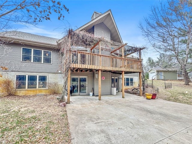 10244 124th St, Chippewa Falls, WI 54729 - back of property with a patio area, a wooden deck, concrete driveway, and a pergola