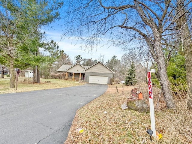 10244 124th St, Chippewa Falls, WI 54729 - view of front facade featuring driveway and a garage