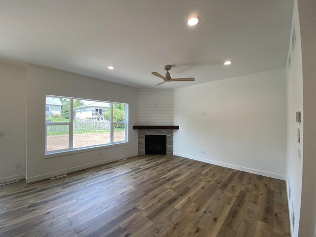 1107 Kampereschroer Way, Sun Prairie, WI 53590 - unfurnished living room with dark wood-style floors, a ceiling fan, recessed lighting, and a fireplace