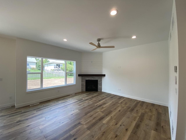 1107 Kampereschroer Way, Sun Prairie, WI 53590 - unfurnished living room with dark wood-style floors, a ceiling fan, recessed lighting, and a fireplace