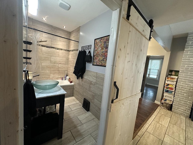 4153 N 60th St, Milwaukee, WI 53216 - bathroom with a bath, a tile shower, tile walls, vanity, and tile patterned floors