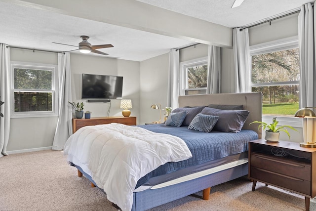 bedroom with carpet floors, ceiling fan, and baseboards
