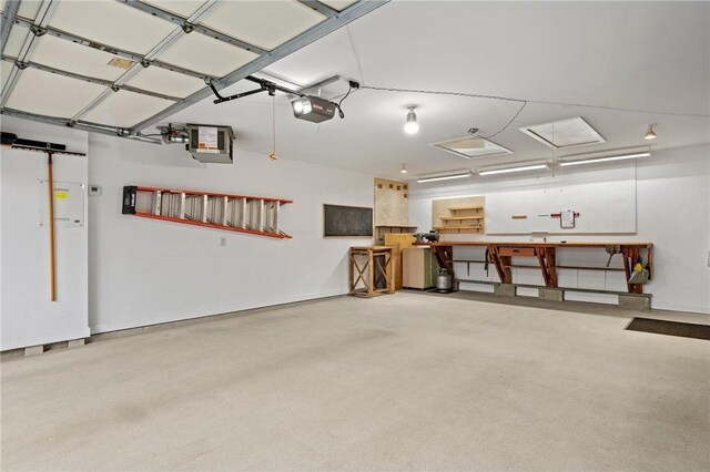 177 W Canyon Dr, Hudson, WI 54016 - garage with a garage door opener and a workshop area