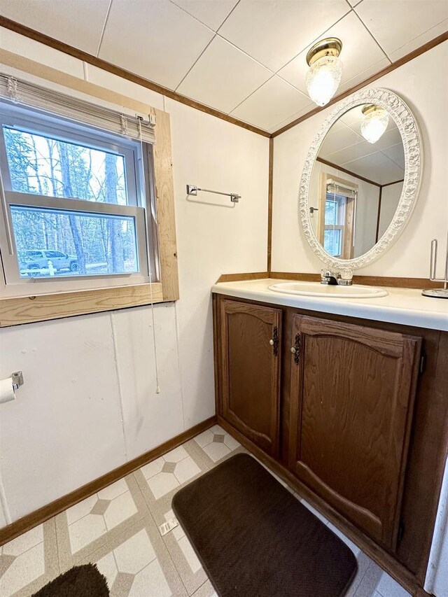 N7824 Typner Lake Rd, Deerbrook, WI 54424 - bathroom with tile patterned floors, vanity, baseboards, and ornamental molding