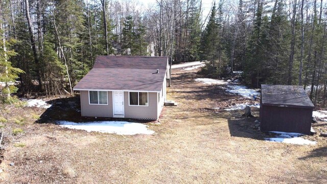 N7824 Typner Lake Rd, Deerbrook, WI 54424 - view of outdoor structure featuring a forest view and an outbuilding