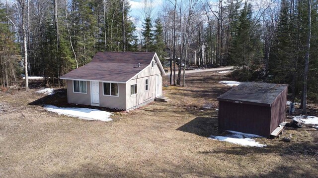 N7824 Typner Lake Rd, Deerbrook, WI 54424 - view of outbuilding with a wooded view and an outdoor structure