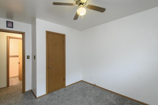 unfurnished bedroom with carpet flooring, baseboards, and ceiling fan