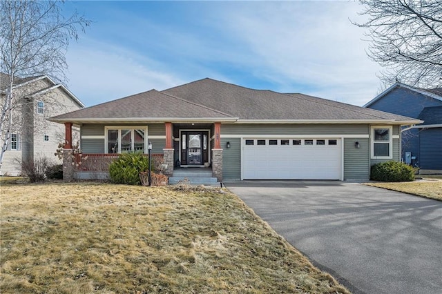 3943 Mill Run Rd, Eau Claire, WI 54703 - view of front of house with driveway, a garage, and a porch