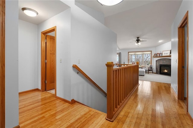 3943 Mill Run Rd, Eau Claire, WI 54703 - hallway with an upstairs landing and light wood-style floors