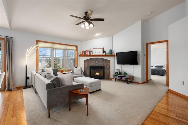 3943 Mill Run Rd, Eau Claire, WI 54703 - living area with a ceiling fan, light wood-style flooring, and a tile fireplace
