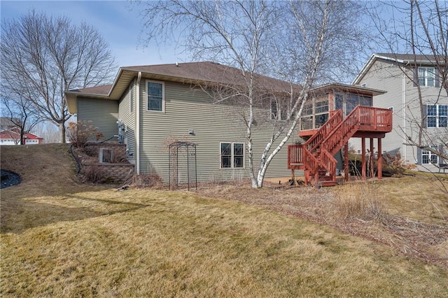3943 Mill Run Rd, Eau Claire, WI 54703 - back of house featuring stairway, a sunroom, a yard, and a wooden deck