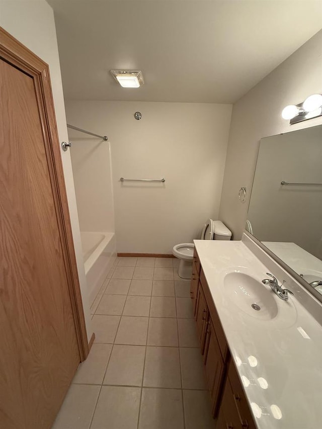 full bathroom featuring tile patterned flooring, vanity, baseboards, and toilet