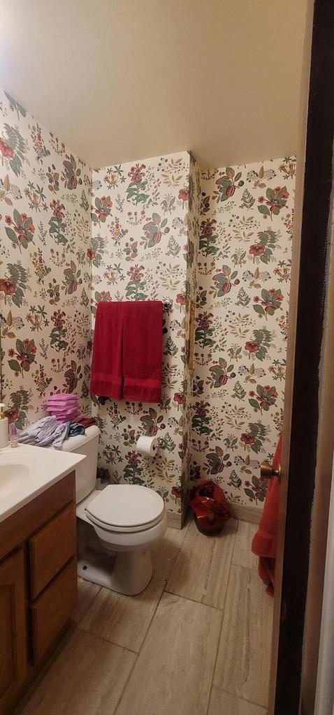 4141 W Cherrywood Ln, Brown Deer, WI 53209 - half bath with vanity, wallpapered walls, toilet, and wood finished floors